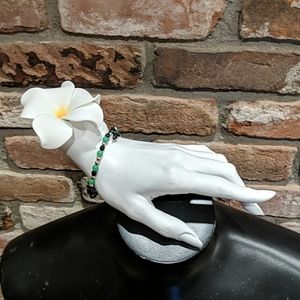 Green and black beaded bracelet